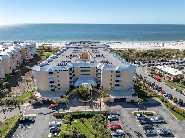 bird's eye view with a water view and a view of the beach