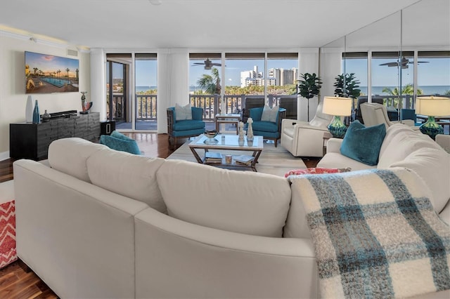 living room featuring hardwood / wood-style floors, ceiling fan, and floor to ceiling windows