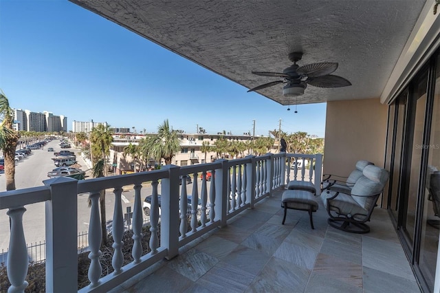 balcony featuring ceiling fan