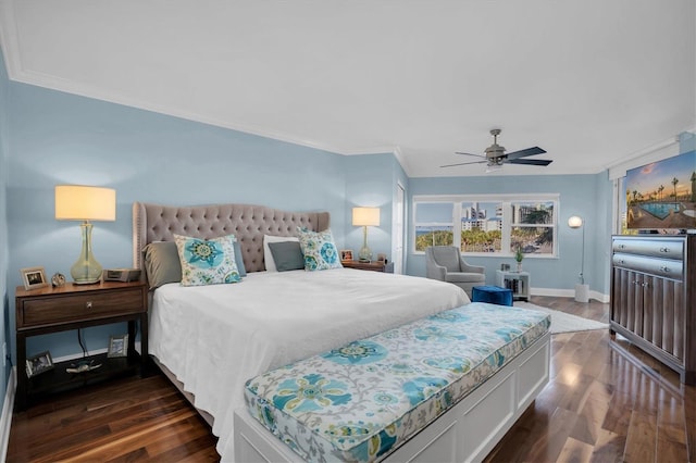 bedroom with dark hardwood / wood-style flooring, ceiling fan, and ornamental molding