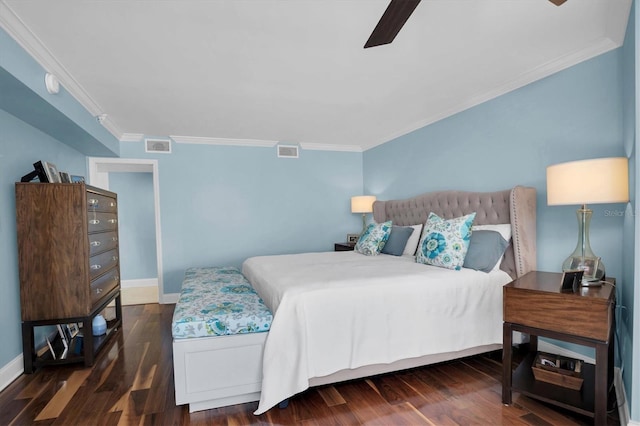 bedroom featuring dark hardwood / wood-style floors, ceiling fan, and ornamental molding