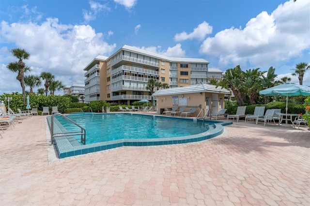 view of swimming pool featuring a patio area