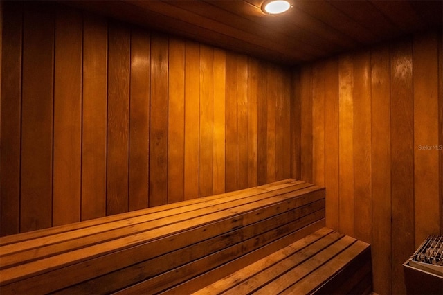 view of sauna / steam room featuring wood walls