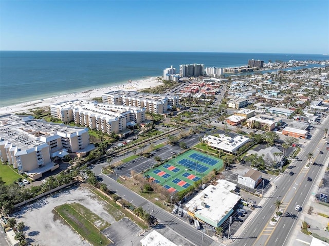 bird's eye view featuring a water view and a beach view