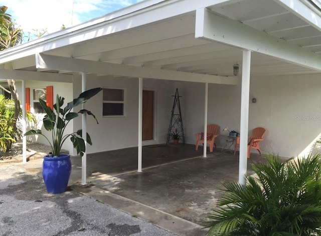 view of patio / terrace with a carport