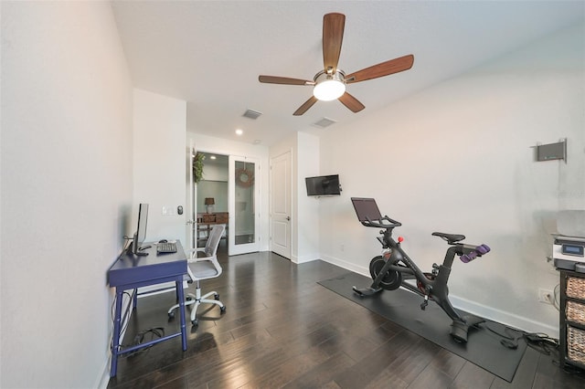 exercise room featuring ceiling fan and dark wood-type flooring