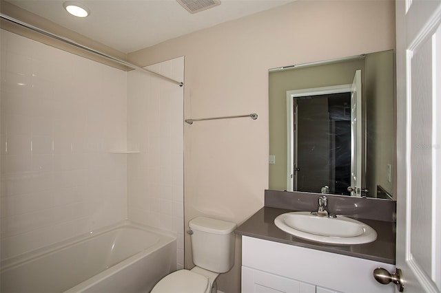 full bathroom featuring vanity, bathing tub / shower combination, and toilet