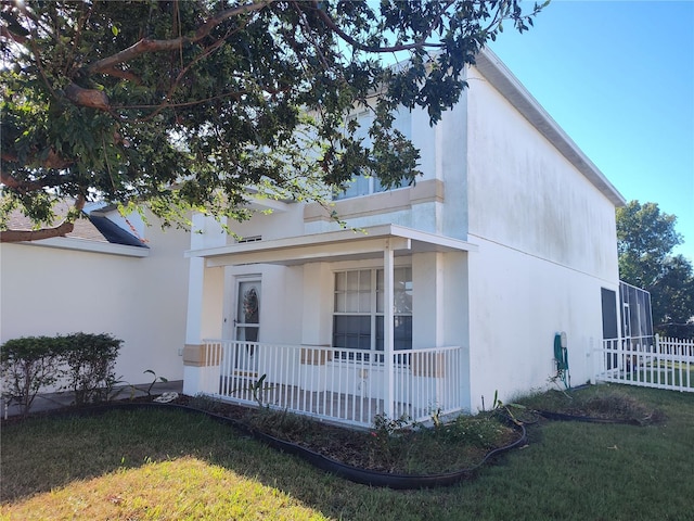 exterior space with a lawn and covered porch