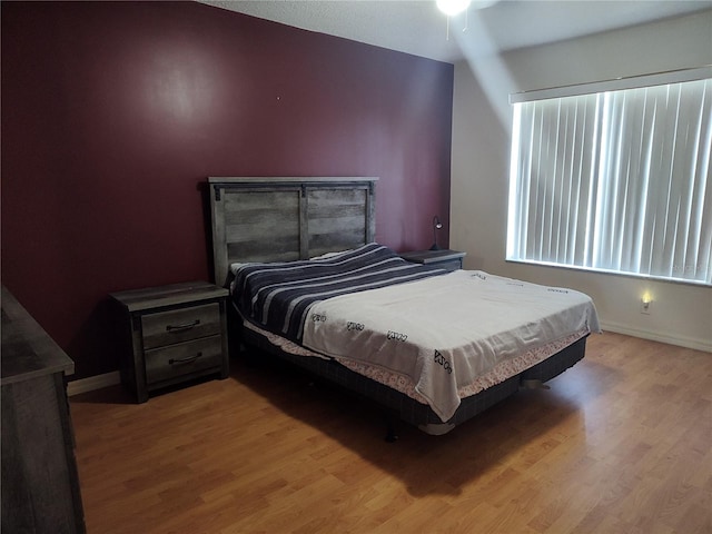 bedroom with light hardwood / wood-style flooring