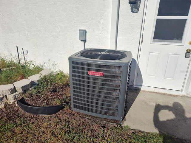 exterior details featuring central AC unit and concrete floors