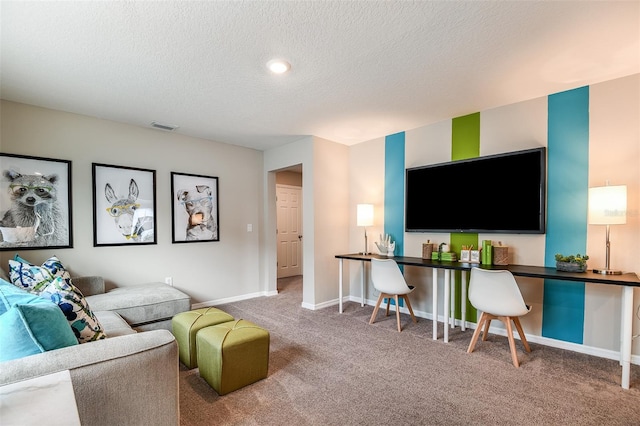 living room featuring carpet floors and a textured ceiling