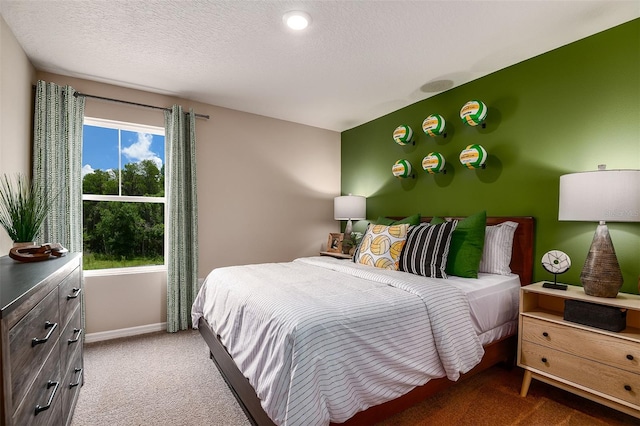 carpeted bedroom with a textured ceiling