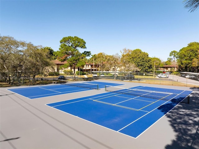 view of sport court with basketball hoop