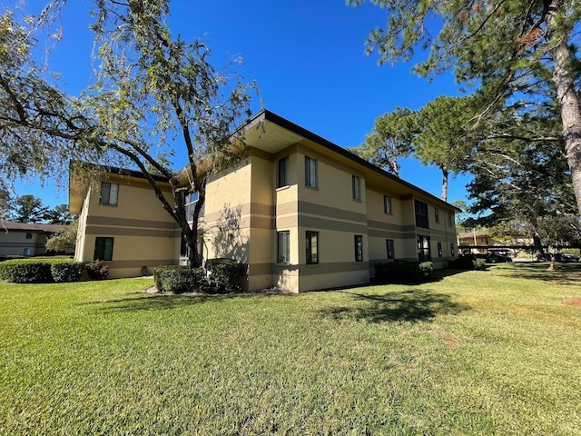 view of property exterior featuring a yard