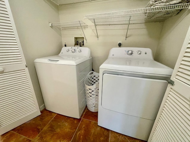 laundry area with washing machine and dryer