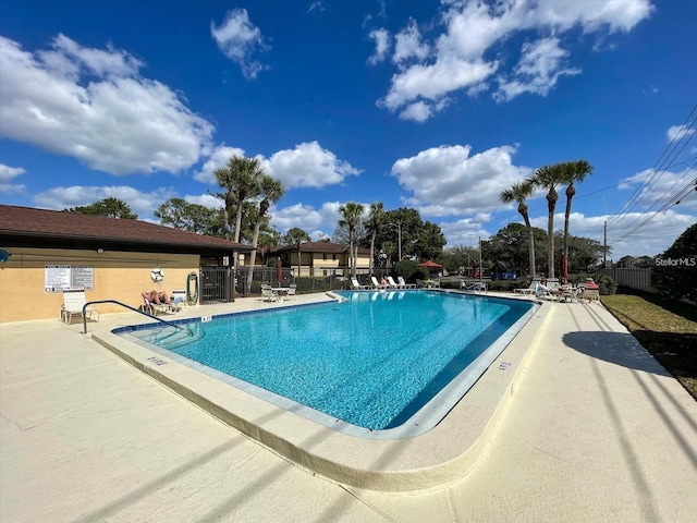 view of swimming pool with a patio area