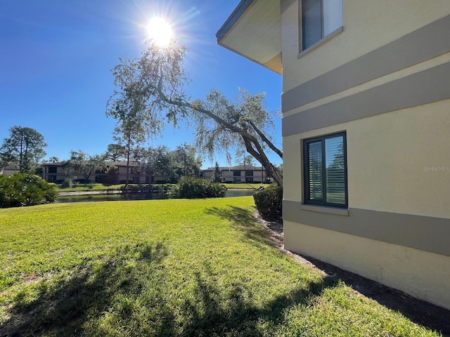 view of yard with a water view