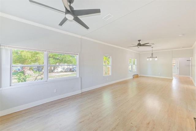 empty room featuring light hardwood / wood-style floors, ceiling fan, and crown molding