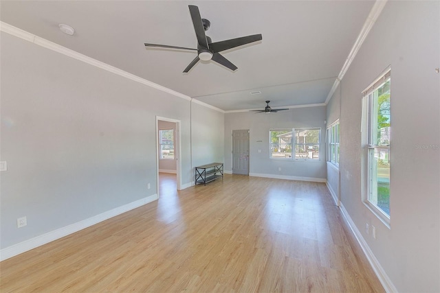 unfurnished living room featuring ceiling fan, light wood-type flooring, and ornamental molding