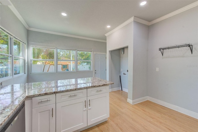 kitchen featuring stainless steel dishwasher, light stone counters, ornamental molding, light hardwood / wood-style flooring, and white cabinetry