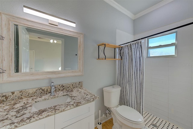 bathroom featuring a shower with shower curtain, vanity, toilet, and ornamental molding