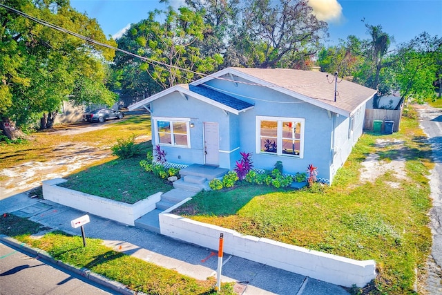 bungalow with a front lawn