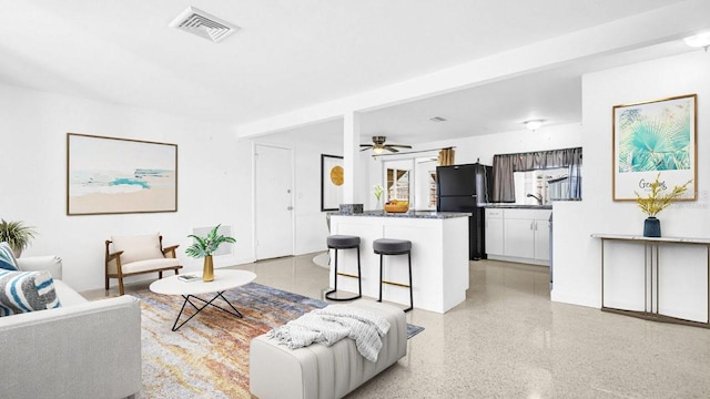 living room with ceiling fan