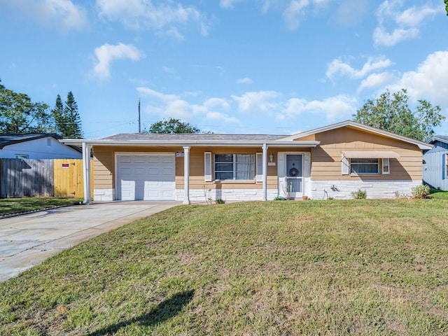 single story home featuring a garage and a front lawn