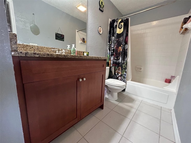 full bathroom featuring vanity, tile patterned floors, toilet, shower / bath combo with shower curtain, and a textured ceiling