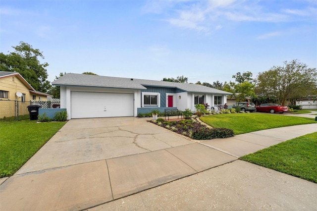 ranch-style house featuring a garage and a front lawn