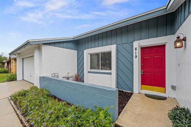 doorway to property featuring a garage