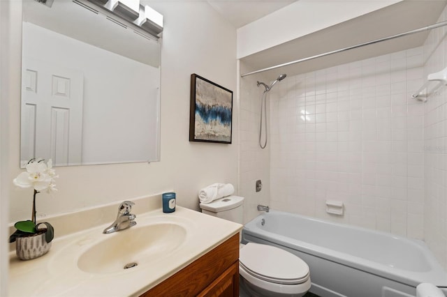 full bathroom with vanity, toilet, and tiled shower / bath combo