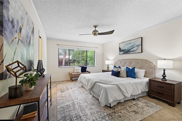 carpeted bedroom featuring ceiling fan, crown molding, and a textured ceiling