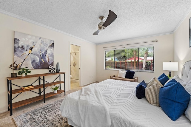 bedroom with carpet, ensuite bathroom, ceiling fan, and a textured ceiling