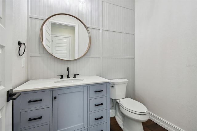 bathroom featuring vanity and toilet