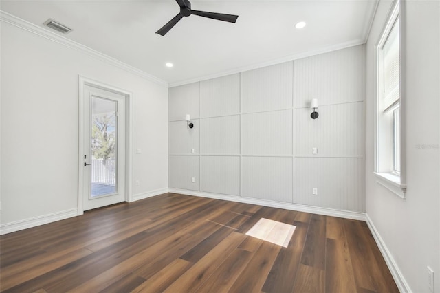 spare room with dark hardwood / wood-style floors, ceiling fan, and crown molding