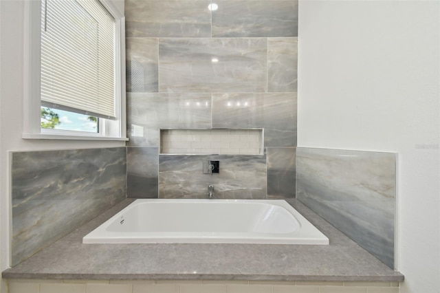 bathroom with tiled tub