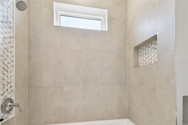 bathroom with a tile shower