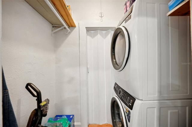 laundry area with stacked washer and clothes dryer