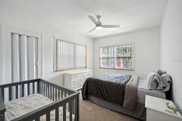 carpeted bedroom with ceiling fan