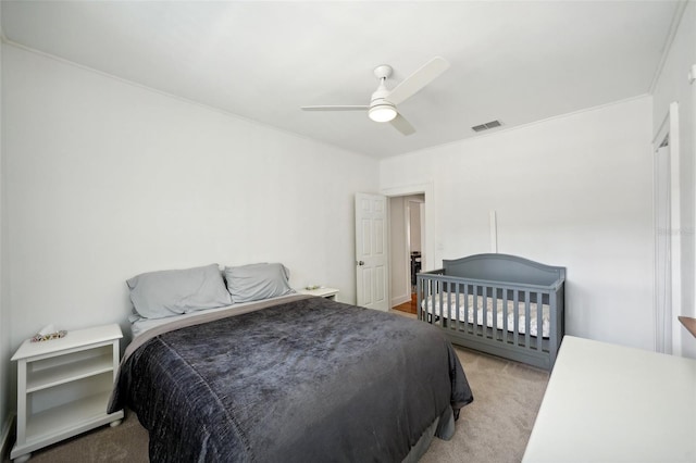 carpeted bedroom featuring ceiling fan