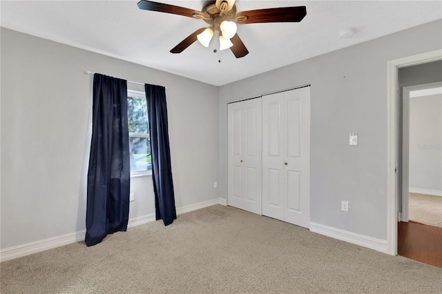 unfurnished bedroom with a closet, ceiling fan, and light colored carpet