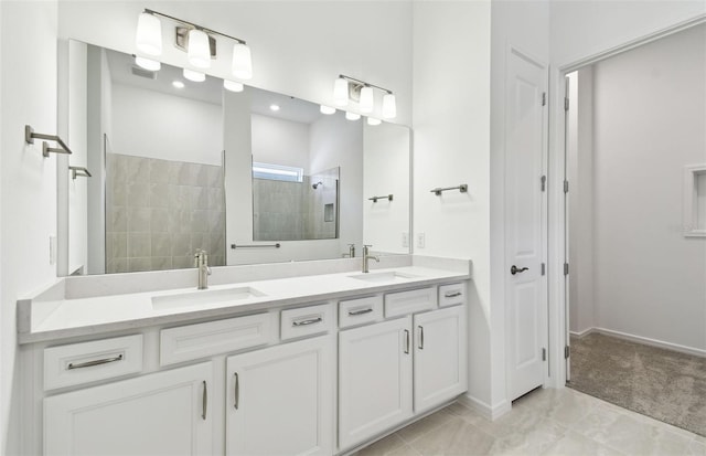 full bath with double vanity, a sink, baseboards, and walk in shower