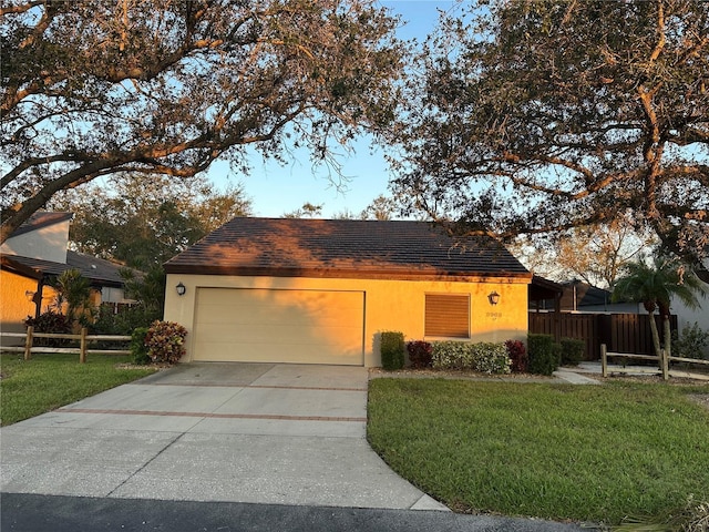 3963 Glen Oaks Manor Dr, Sarasota, FL 34232 - view of front of home featuring a garage, driveway, stucco siding, and roof with shingles