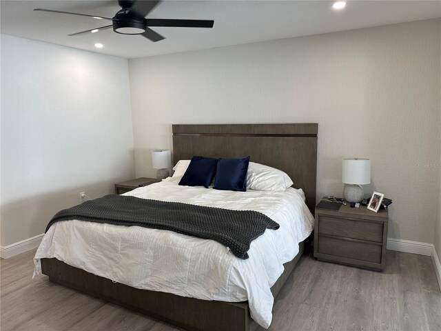 bedroom featuring ceiling fan and wood-type flooring