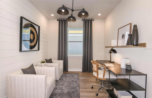 office area with light hardwood / wood-style floors