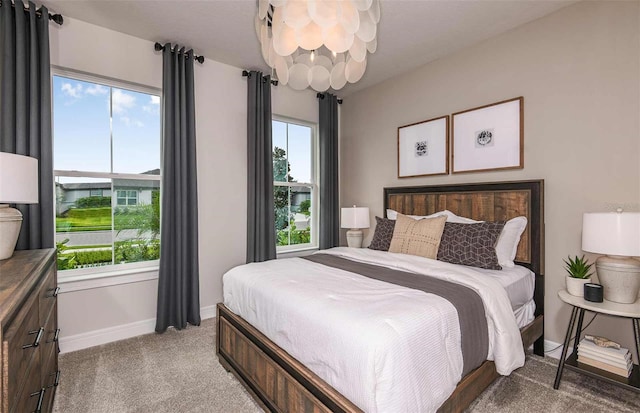 carpeted bedroom with multiple windows