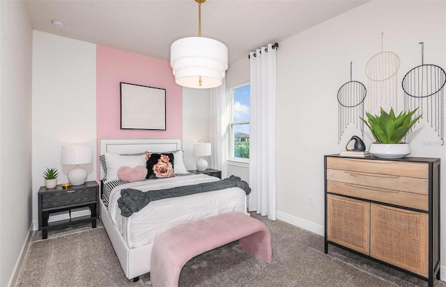 bedroom with dark colored carpet