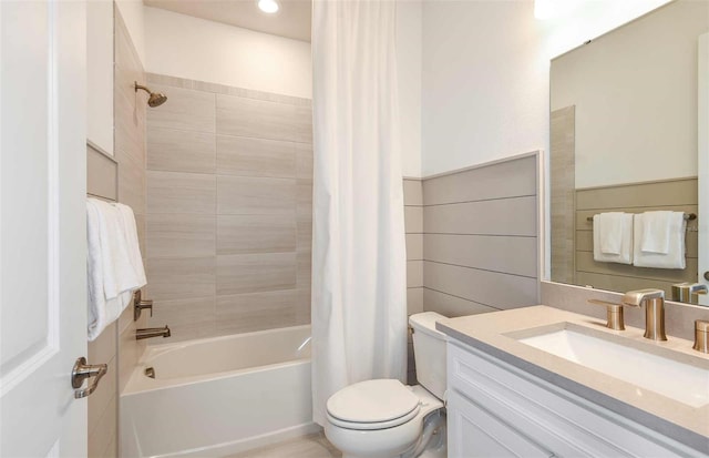 full bathroom with vanity, toilet, and shower / bath combo with shower curtain