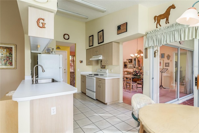 kitchen featuring sink, hanging light fixtures, white appliances, light brown cabinetry, and light tile patterned floors